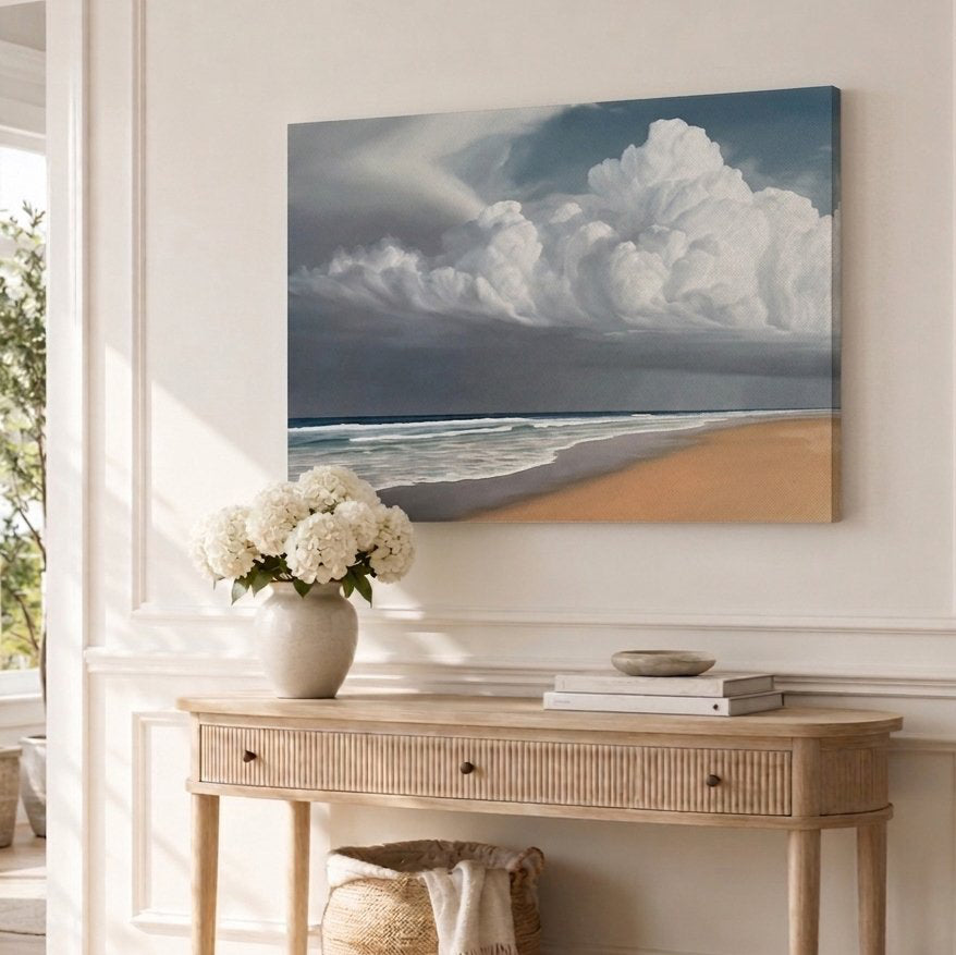 Beach scene painting above a wooden console table with decor items.